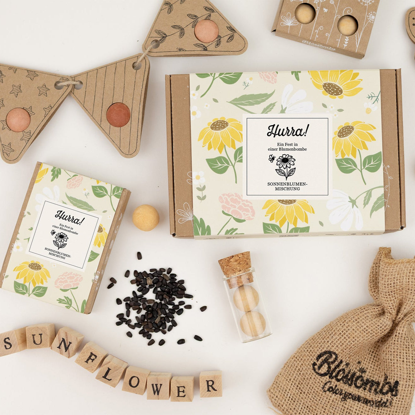 Geschenkbox Small „Hurra!“ mit 7 Saatbomben der Sonnenblumenmischung